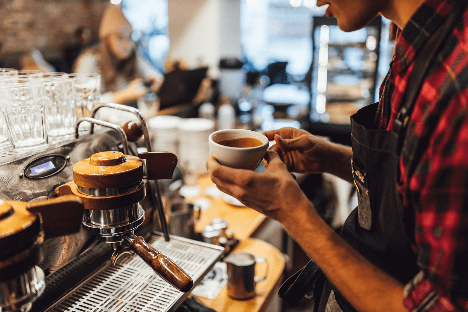 Café owner serving coffee